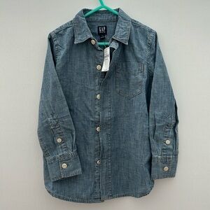 New with tags. GAP denim button down shirt. Boys. XS (4-5). Never worn.